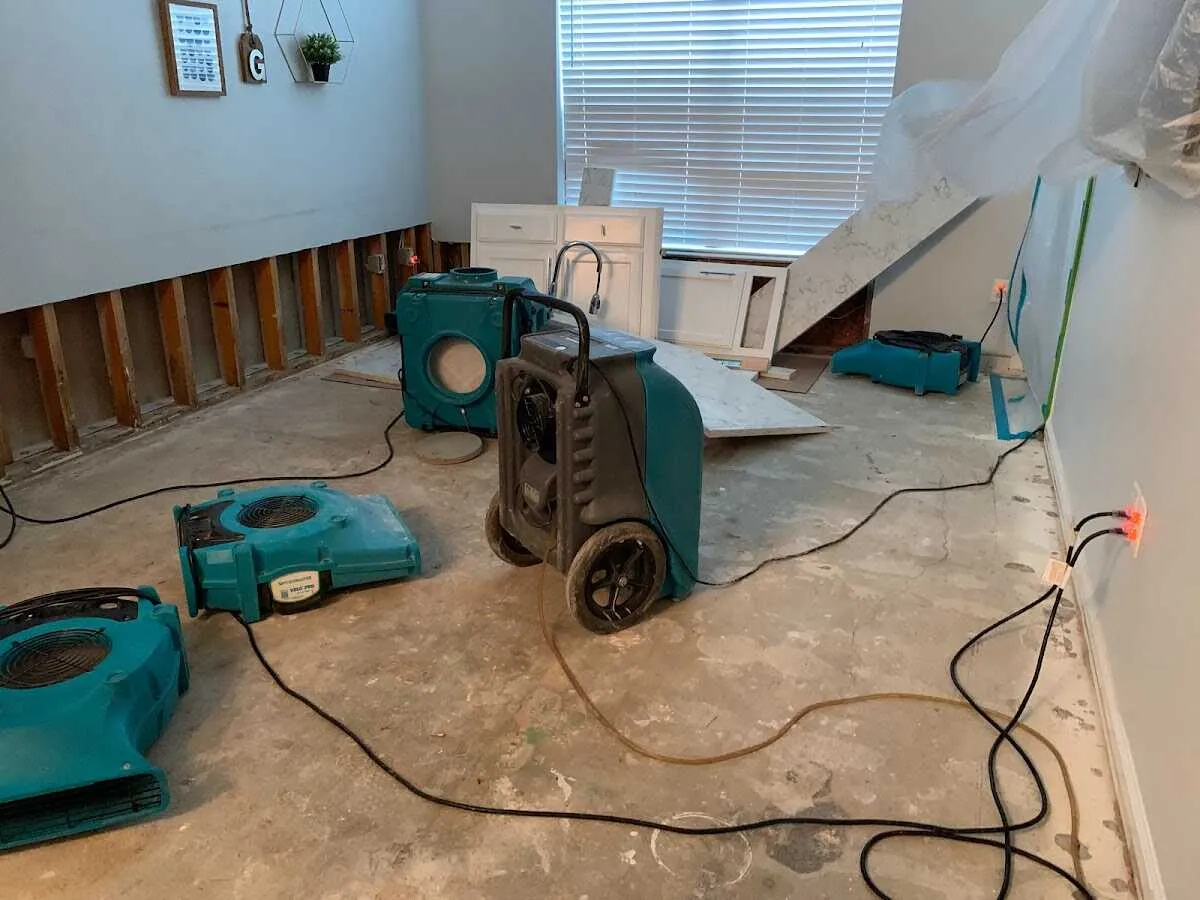 Dehumidifier in flood-cut room for Water Damage Restoration in Avon